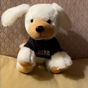 Plush floppy ear red white dog that loves Atlanta